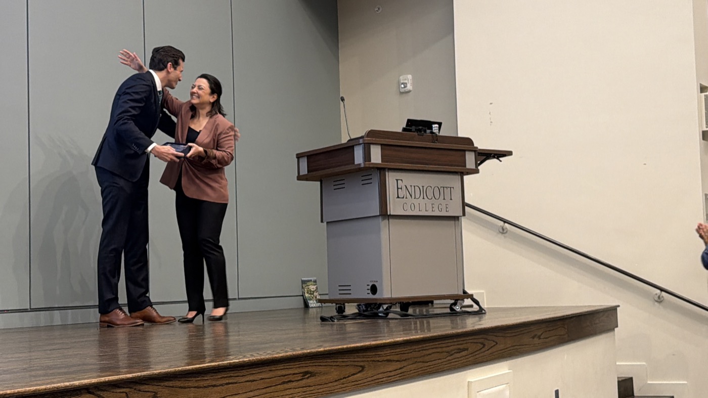 Ani Attamian presenting the inaugural Diruhi Mattian Award to Brian Anderson at Endicott College, May 2026